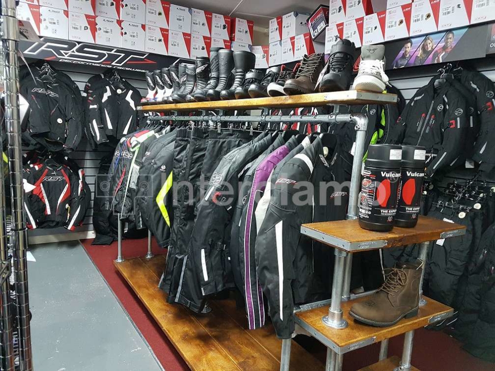 Key clamp clothes rail and shelving for motorcycle dealership